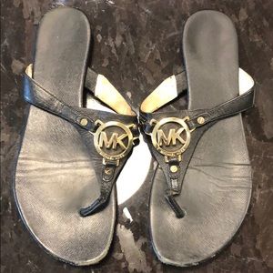 Michael Kors black and gold flat sandals